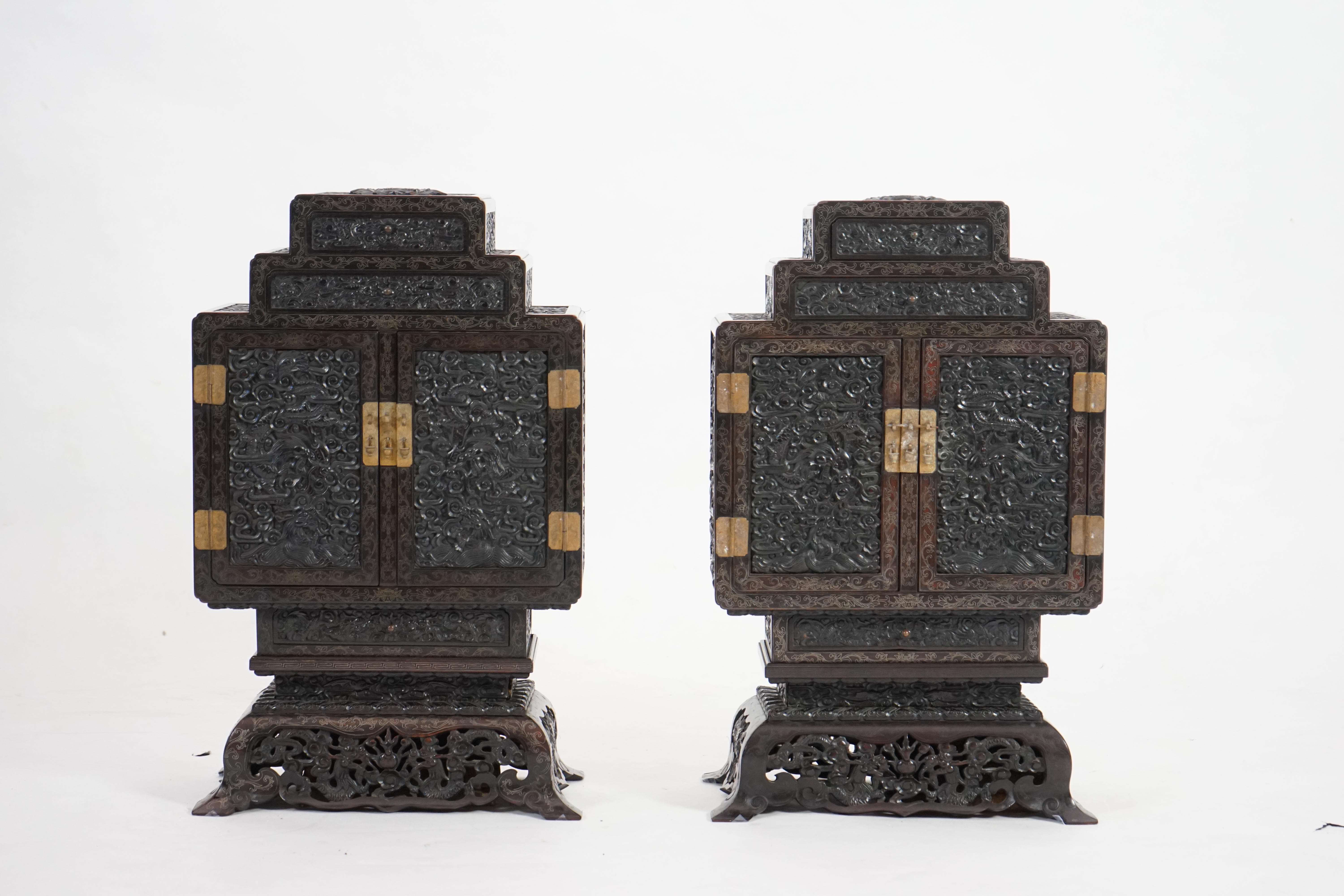 An important pair of Chinese carved zitan and silver wire inlaid ‘cloud and dragon’ curio cabinets and stands, duobaoge, probably Imperial, late Qing dynasty